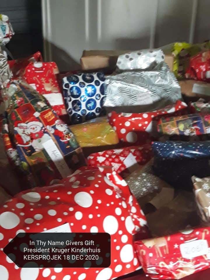 Wrapped Christmas gifts donated by In Thy Name Givers Gift to President Kruger Kinderhuis